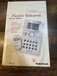 Radio Shack Passive Infrared Sensor Alarm 49-329 With Key Chain Remote Open. Price: $23.00.